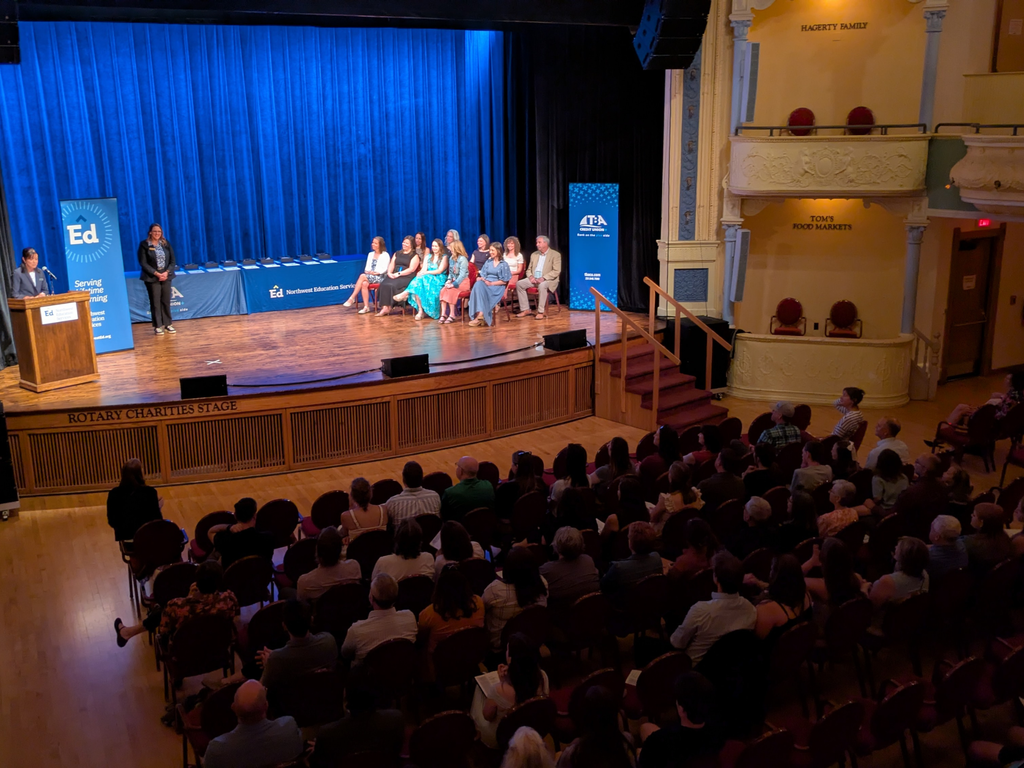 View of the audience and honorees on stage at the 2026 Outstanding Educator Awards. 