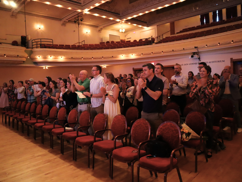 Crowd at the 2026 Outstanding Educator Awards giving a standing ovation. 