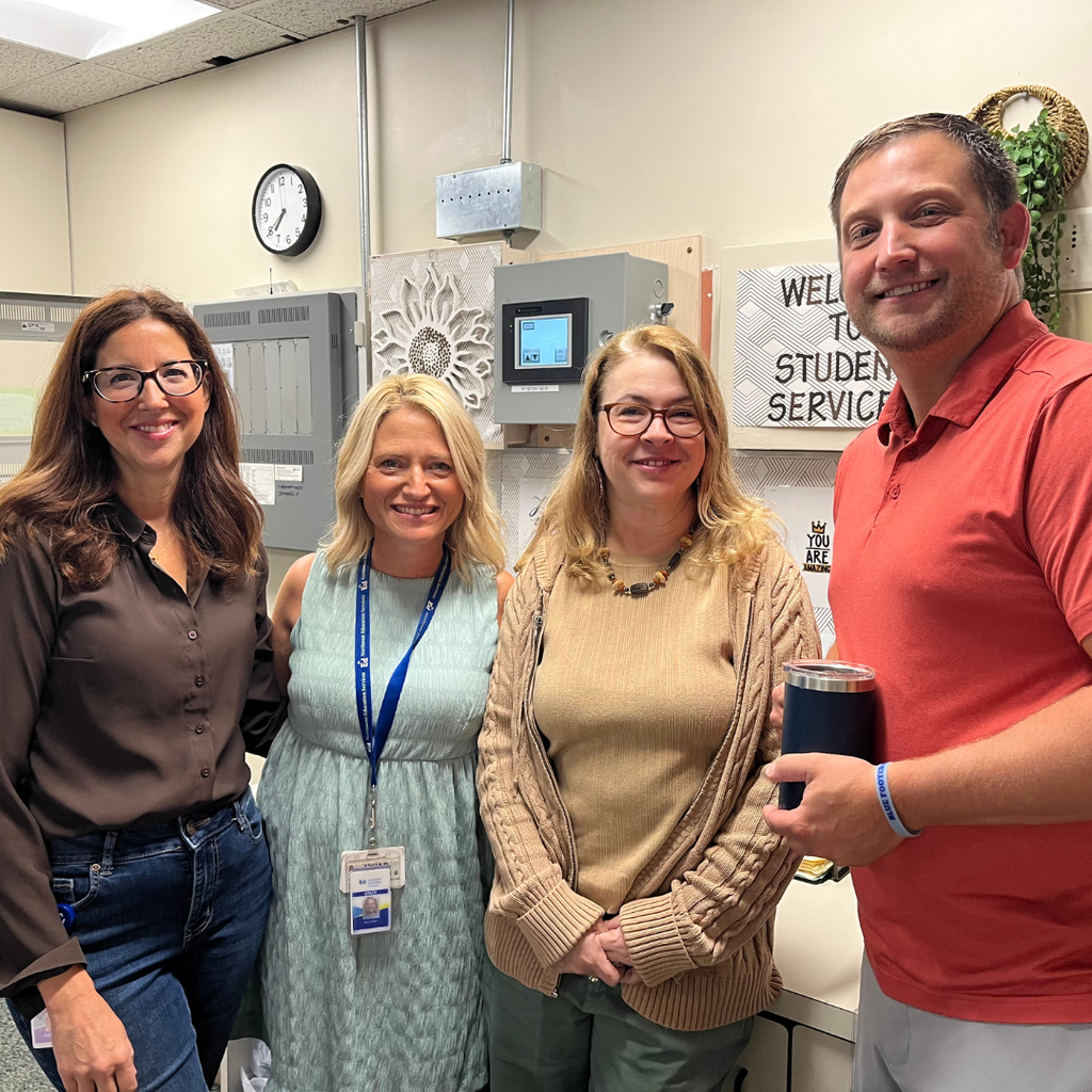 Four North Ed Career Tech staff members smiling and posing for a photo. 