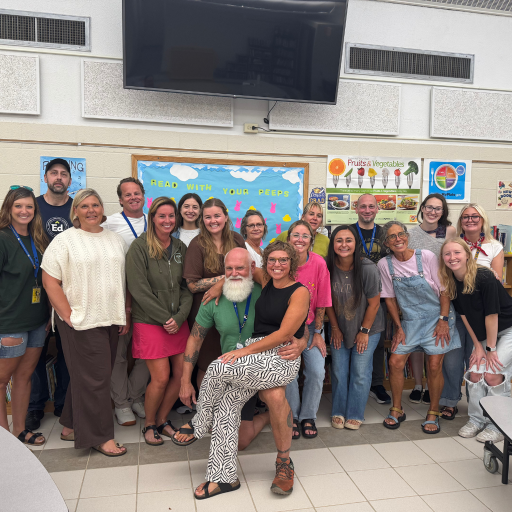 North Ed Creekside School staff posing for a group photo inside the library/cafeteria on Opening Day.
