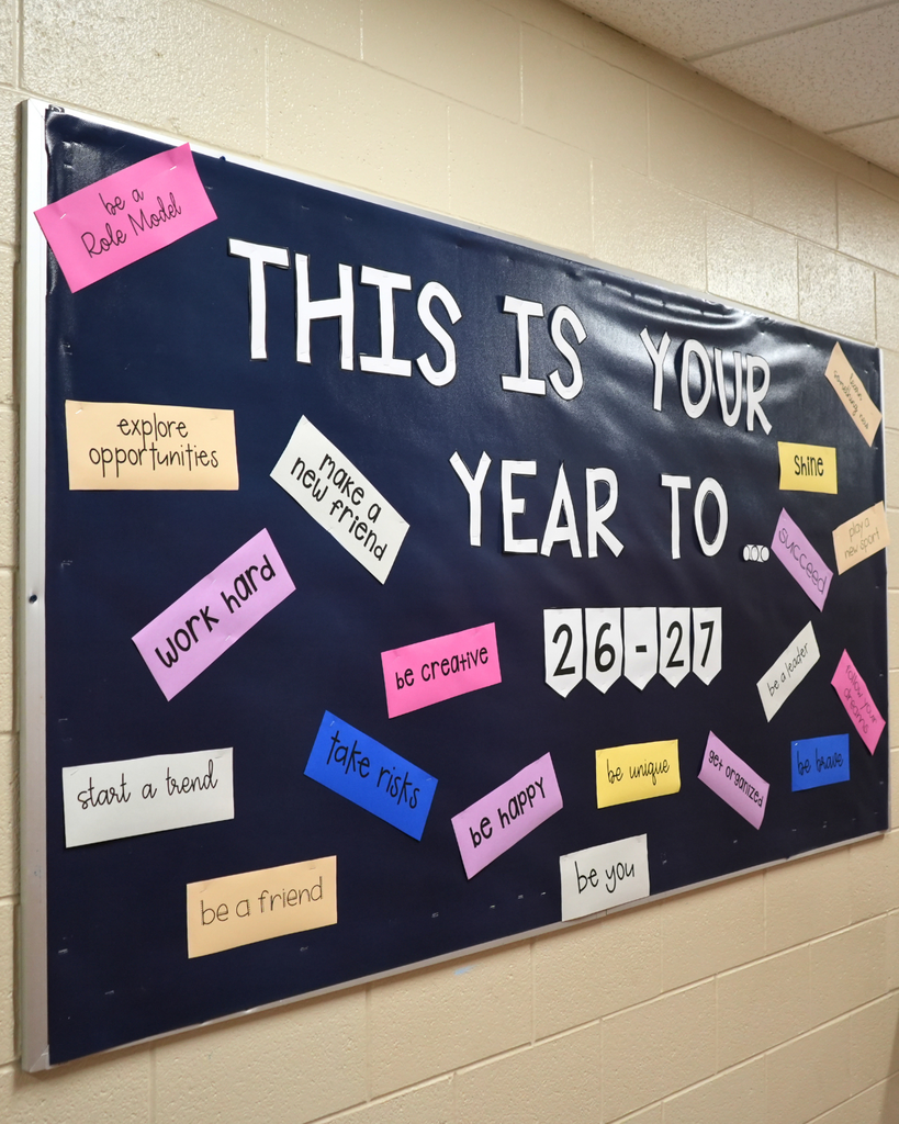 Bulletin board in the school hallway that reads “This is your year to… 26-27”.