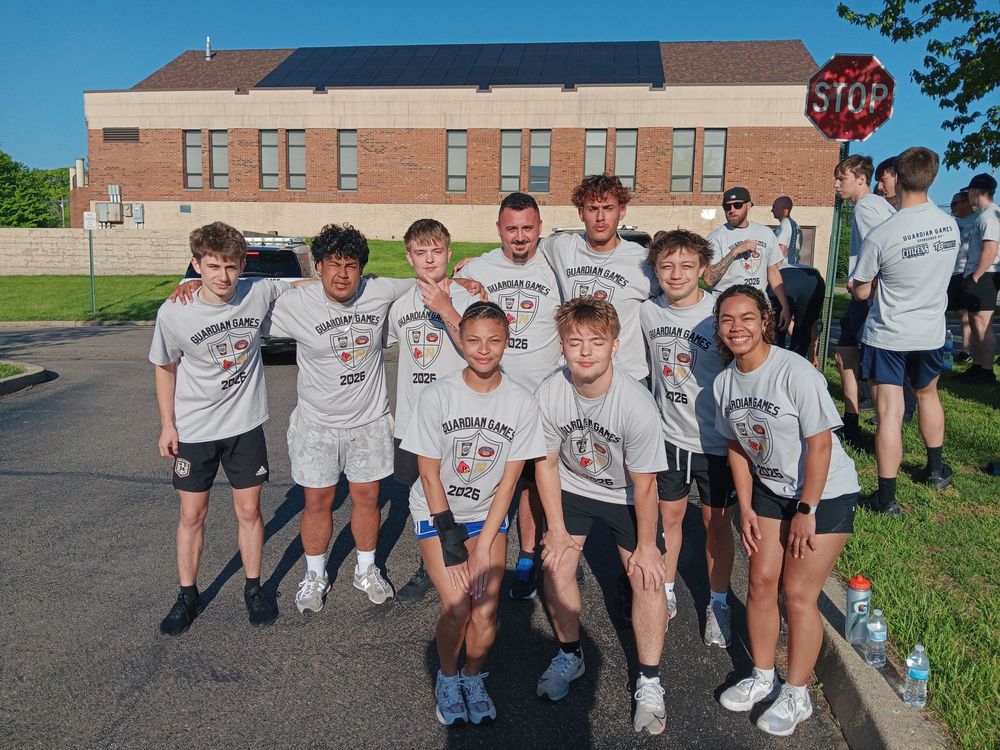 Students standing in front of a building
