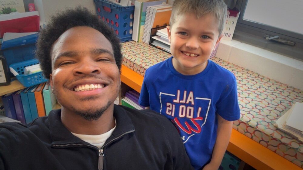 Teacher and student taking a selfie smiling