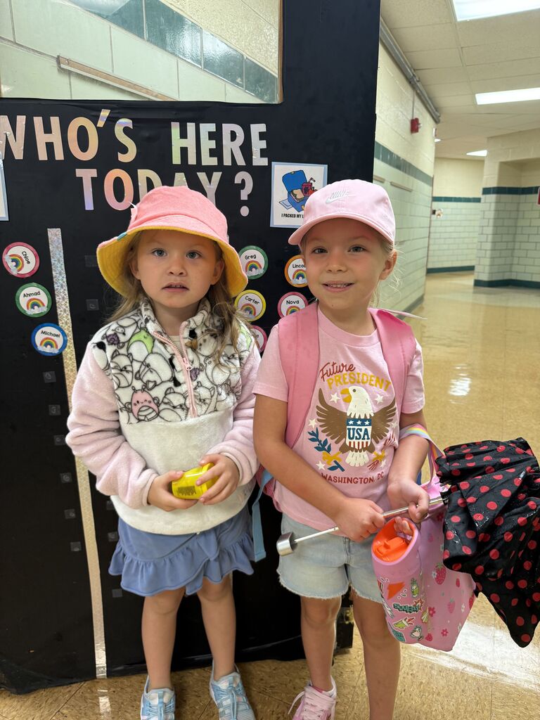 two students wearing hats