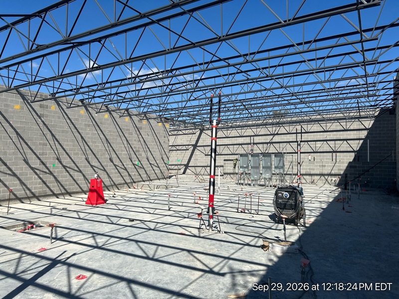 Crews continue installing the building's "nervous system" (wiring, plumbing, and heating) on the lower level, while walls are framed on the main level.