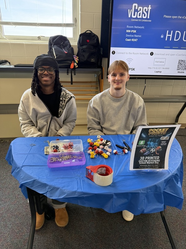 two students sitting a table