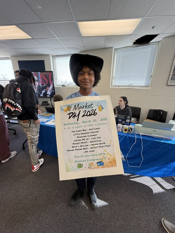 student holding a sign