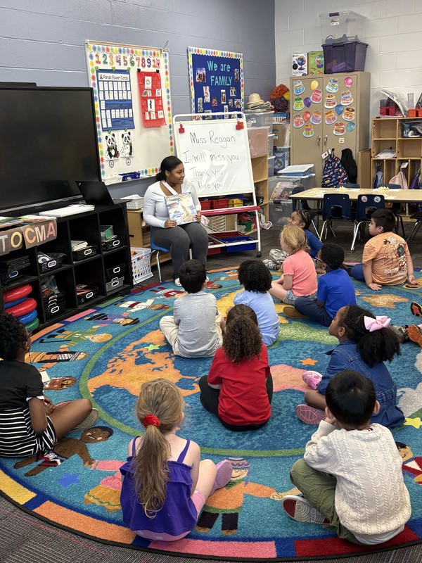 A teen reads to children