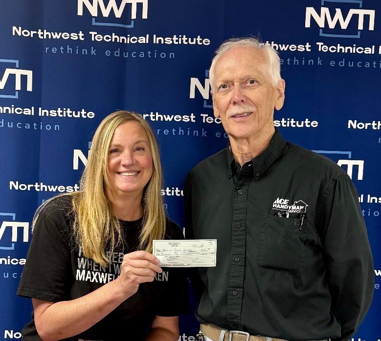 Steve Langton of the Rogers' Optimist Club presents a check to NWTI