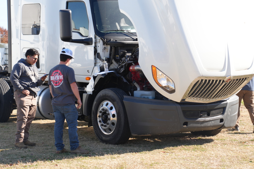 Students checking over diesel truck