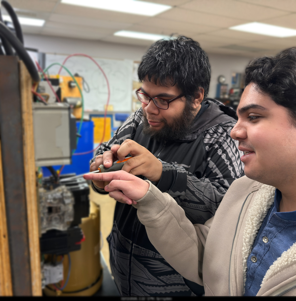 NWTI electronics and automation students work on a 3 phase motor control