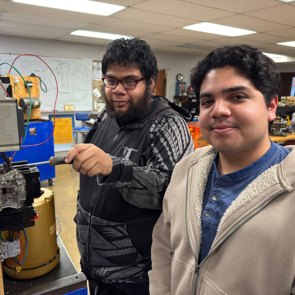 NWTI electronics and automation students work on a 3 phase motor control