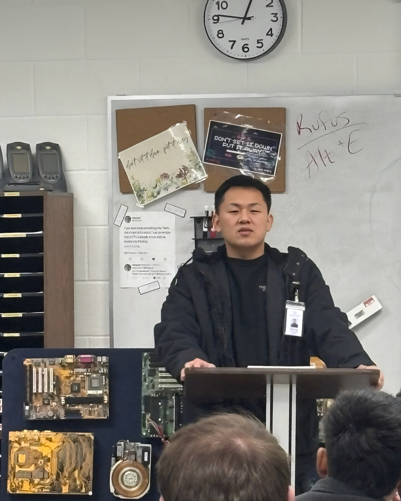 Recent NWTI graduate from our Information Systems program Timmy Xiong talks to current the NWTI I.S. class