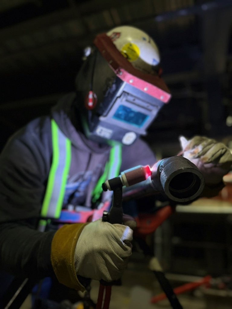 Former NWTI welding student Alex AJ Arriaga hard at work welding at Thompson Construction