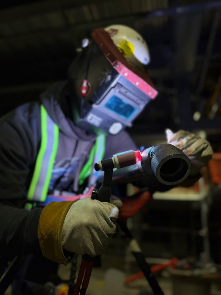Former NWTI welding student Alex AJ Arriaga hard at work welding at Thompson Construction