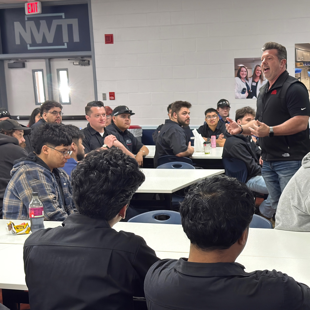 automotive students listen to a presentation from mac tools