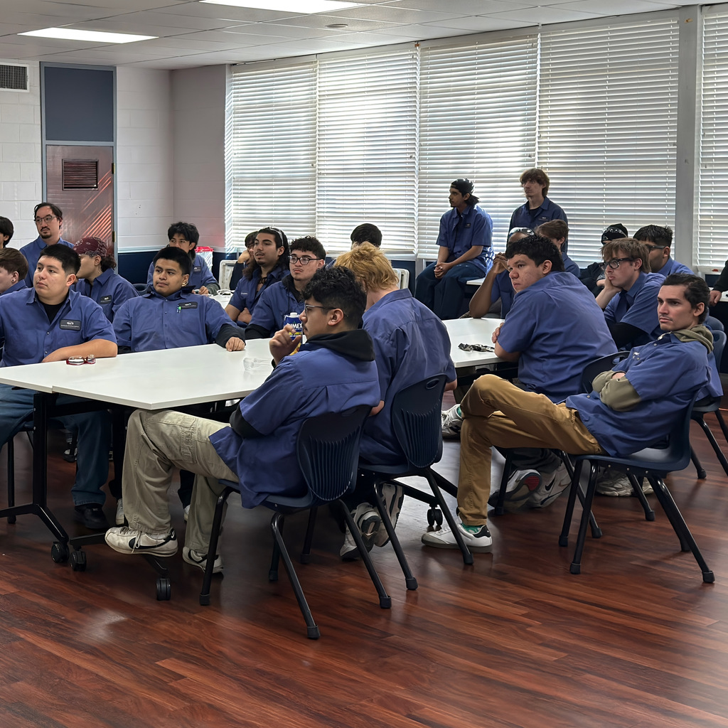 automotive students listen to a presentation from mac tools