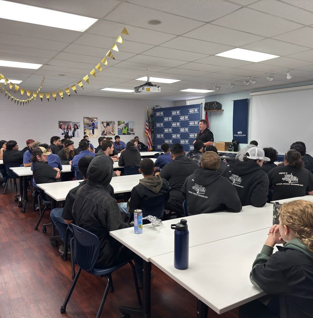 automotive students listen to a presentation from mac tools