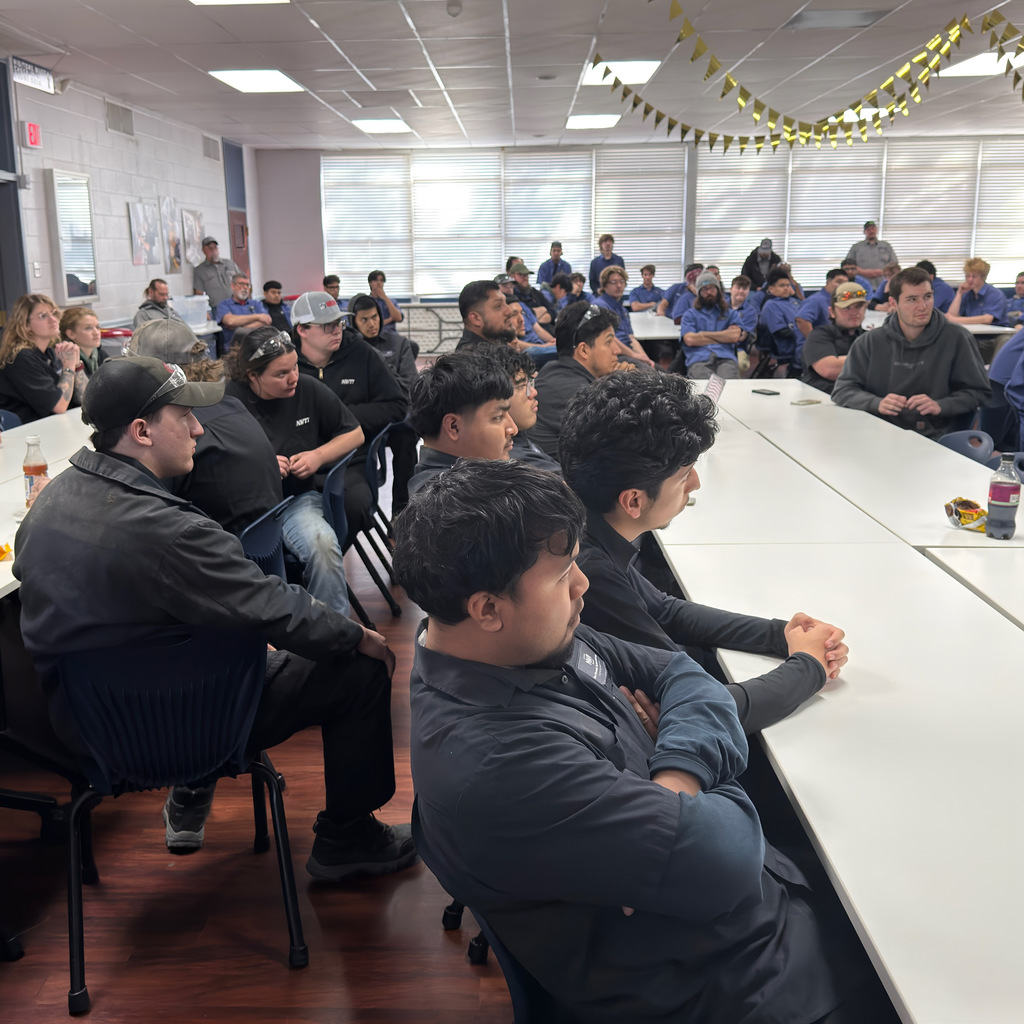 automotive students listen to a presentation from mac tools