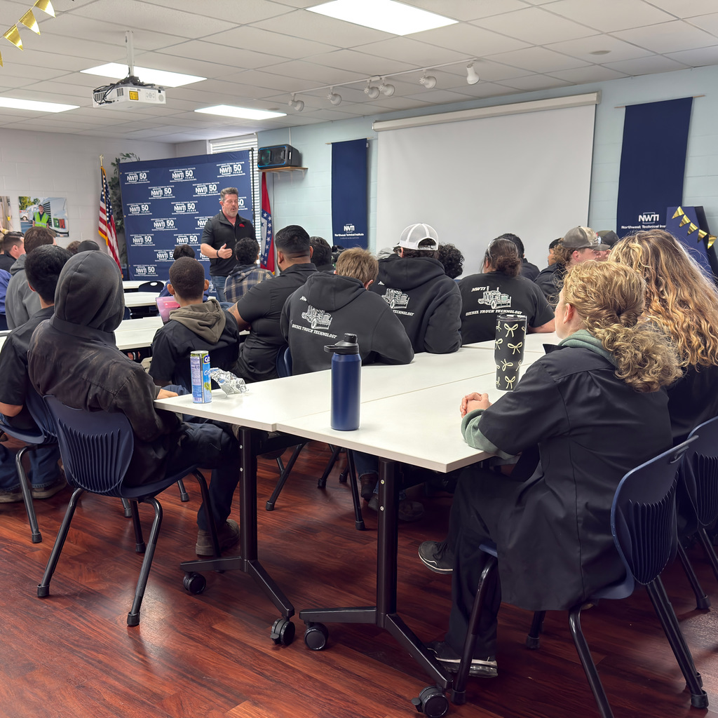 automotive students listen to a presentation from mac tools