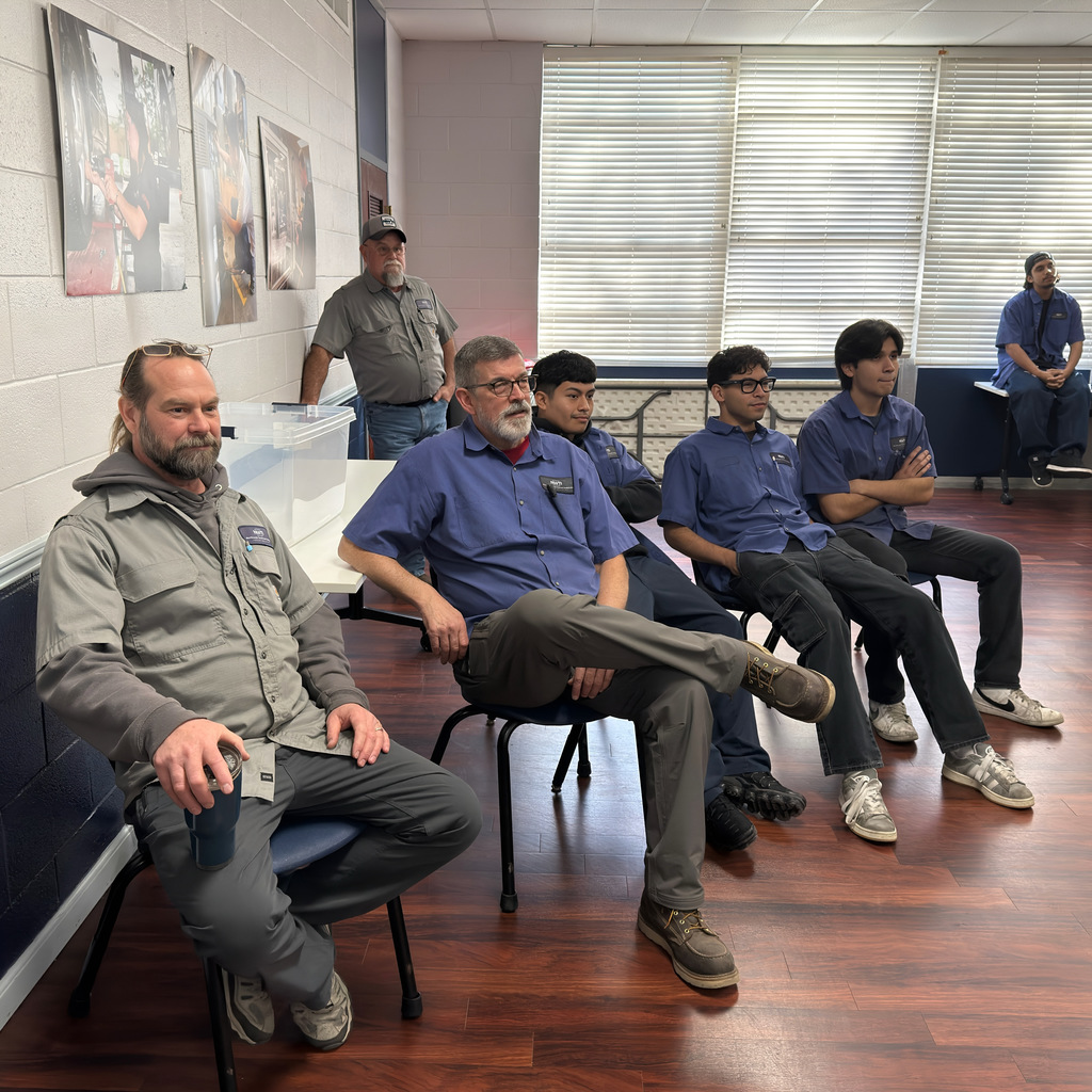 automotive students listen to a presentation from mac tools