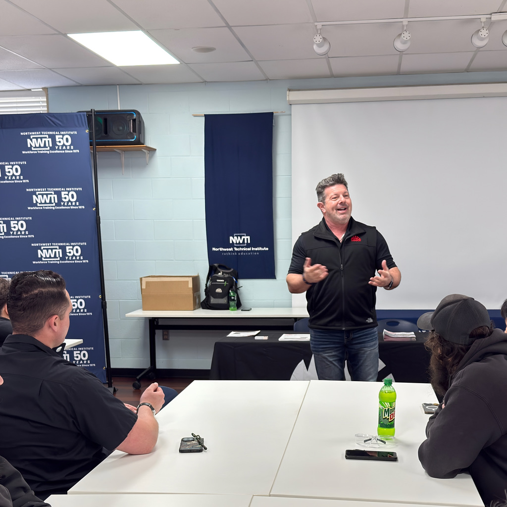 automotive students listen to a presentation from mac tools