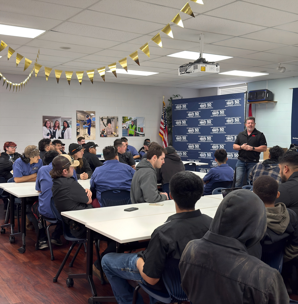 automotive students listen to a presentation from mac tools