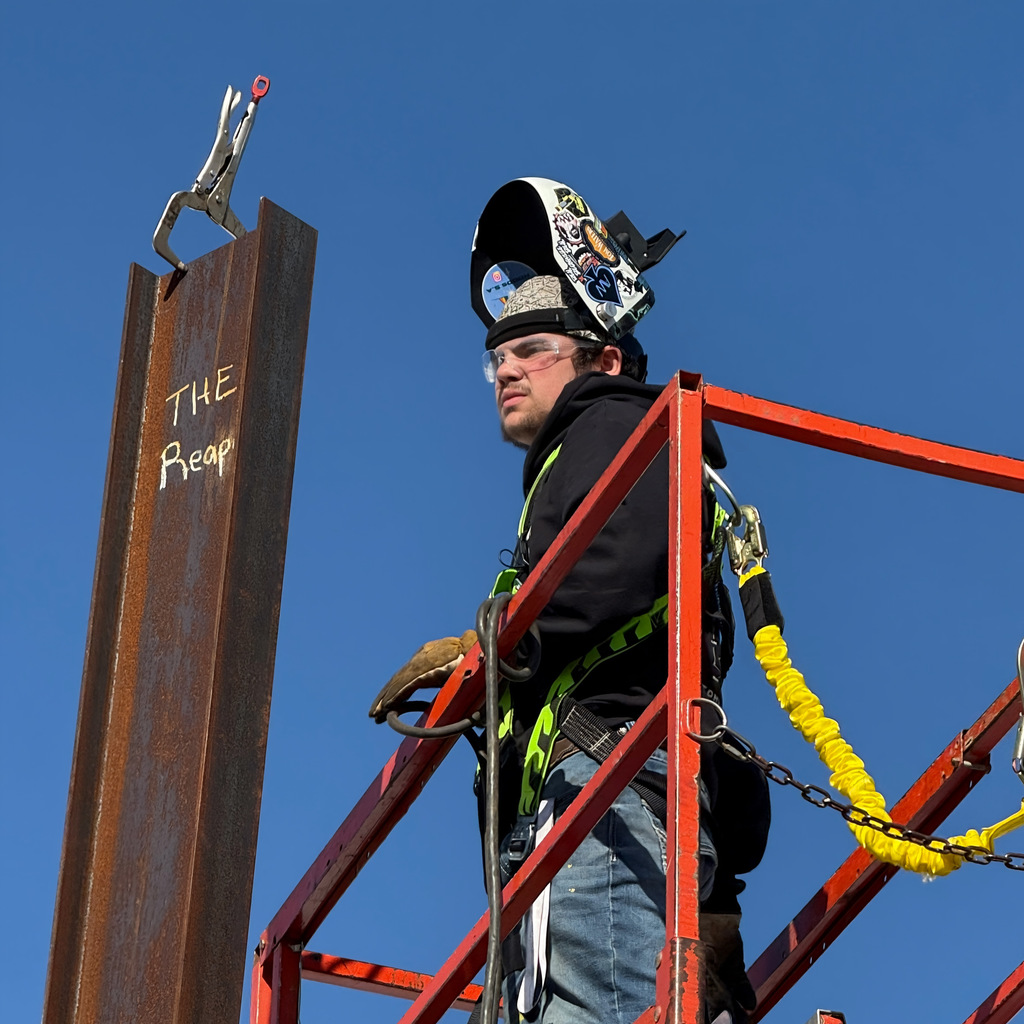 Welding students up on a crane
