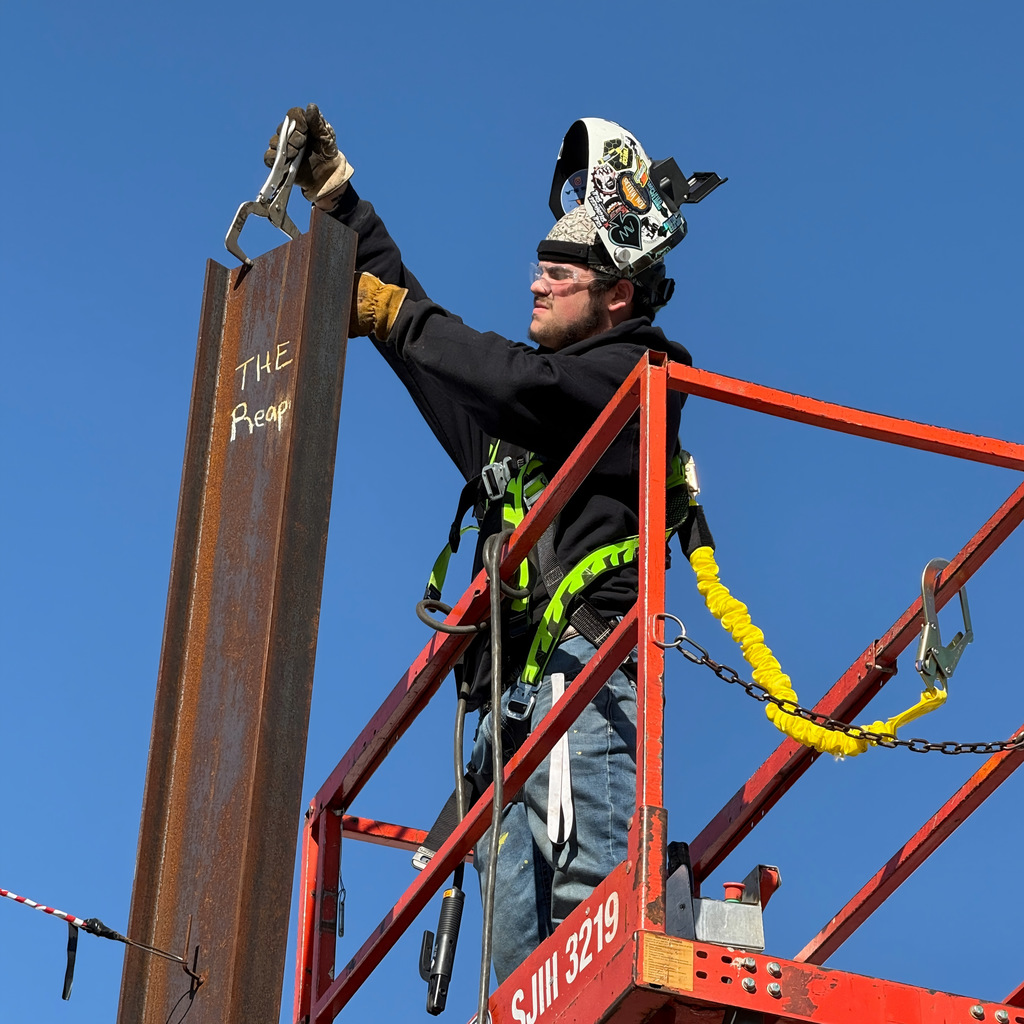 Welding students up on a crane