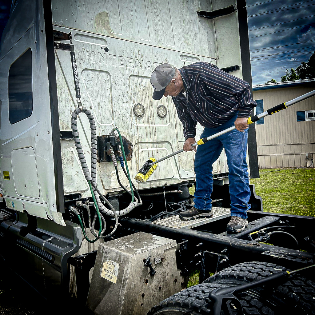 CDL instructor lonnie o'bryant washes a semi truck