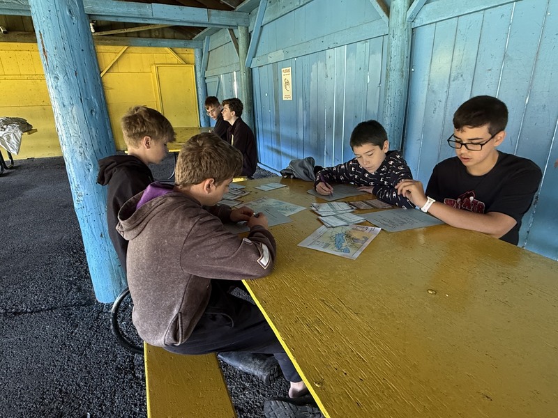 Middle school students exploring creek at Albion Boro Park