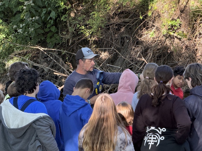 Middle school students exploring creek at Albion Boro Park