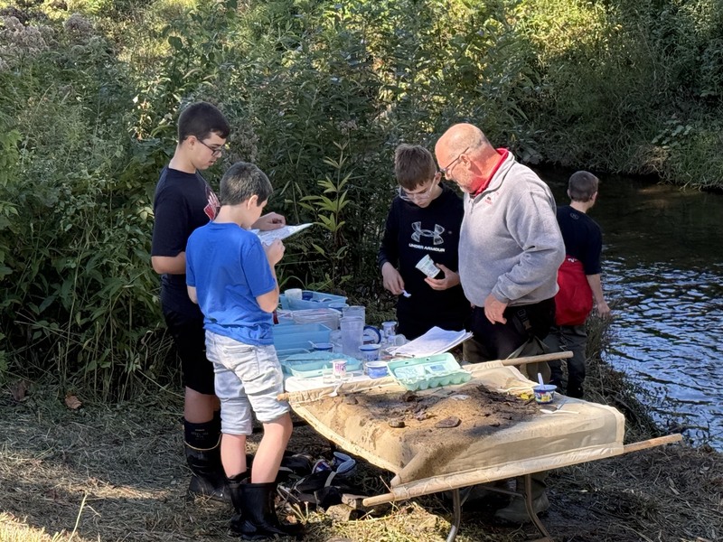 Middle school students exploring creek at Albion Boro Park