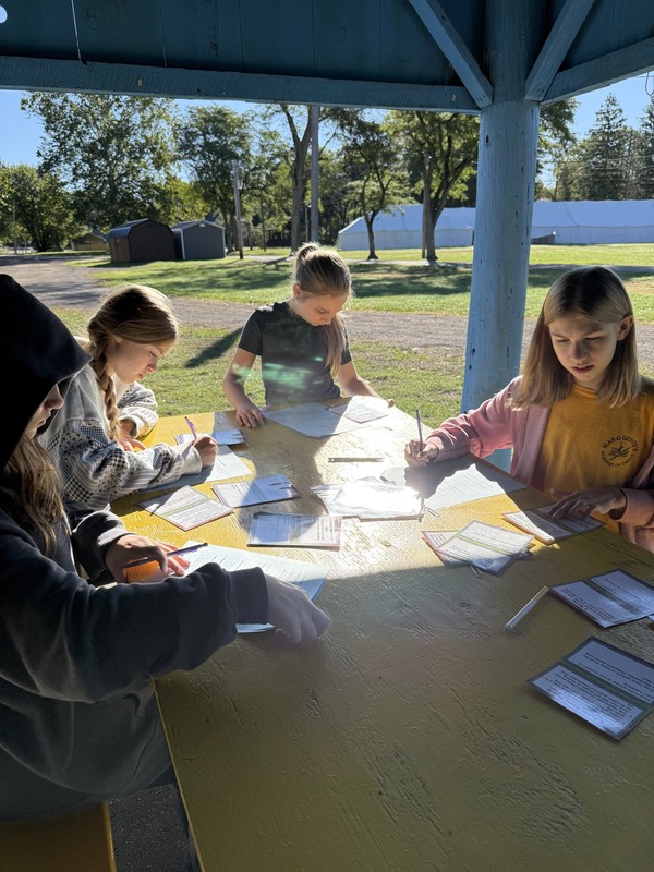 Middle school students exploring creek at Albion Boro Park