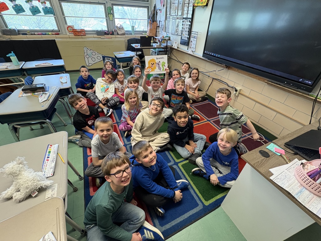 kids sitting on floor smiling