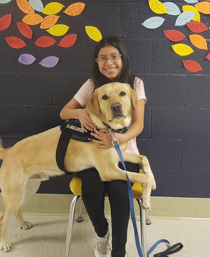 girl on chair, dog on her lap