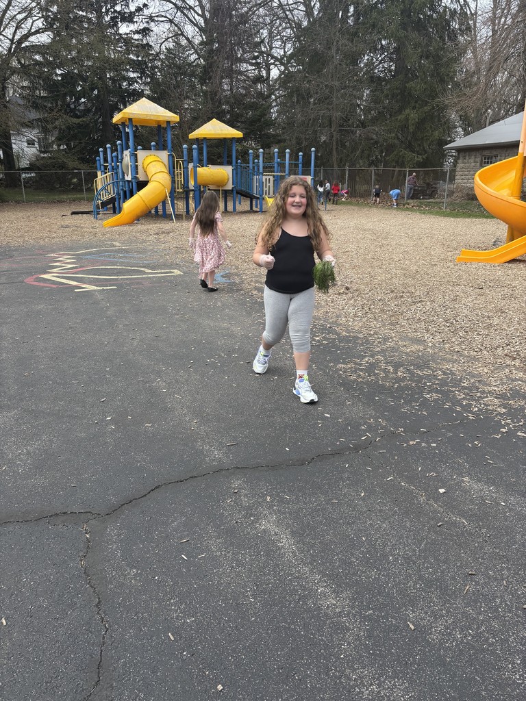 girl picking up trash