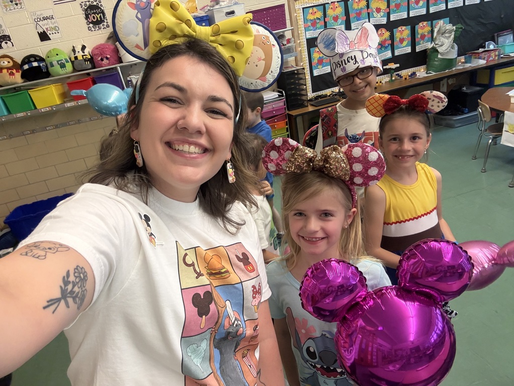 kids and teacher with mickey mouse ears