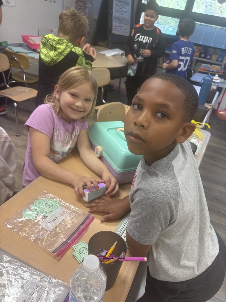 Students shopping in classroom
