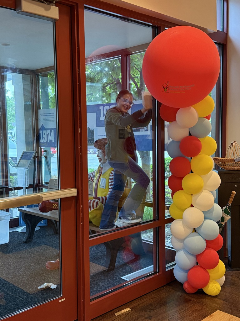 lady hanging up balloons
