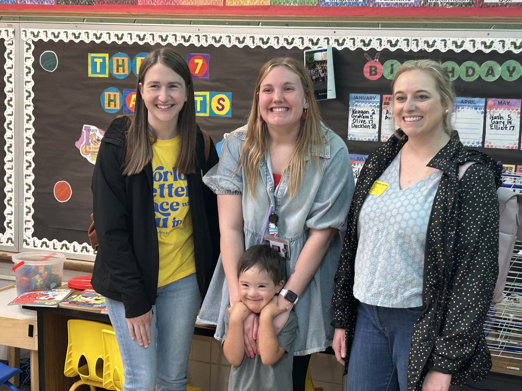 Teacher with parents and a kid 