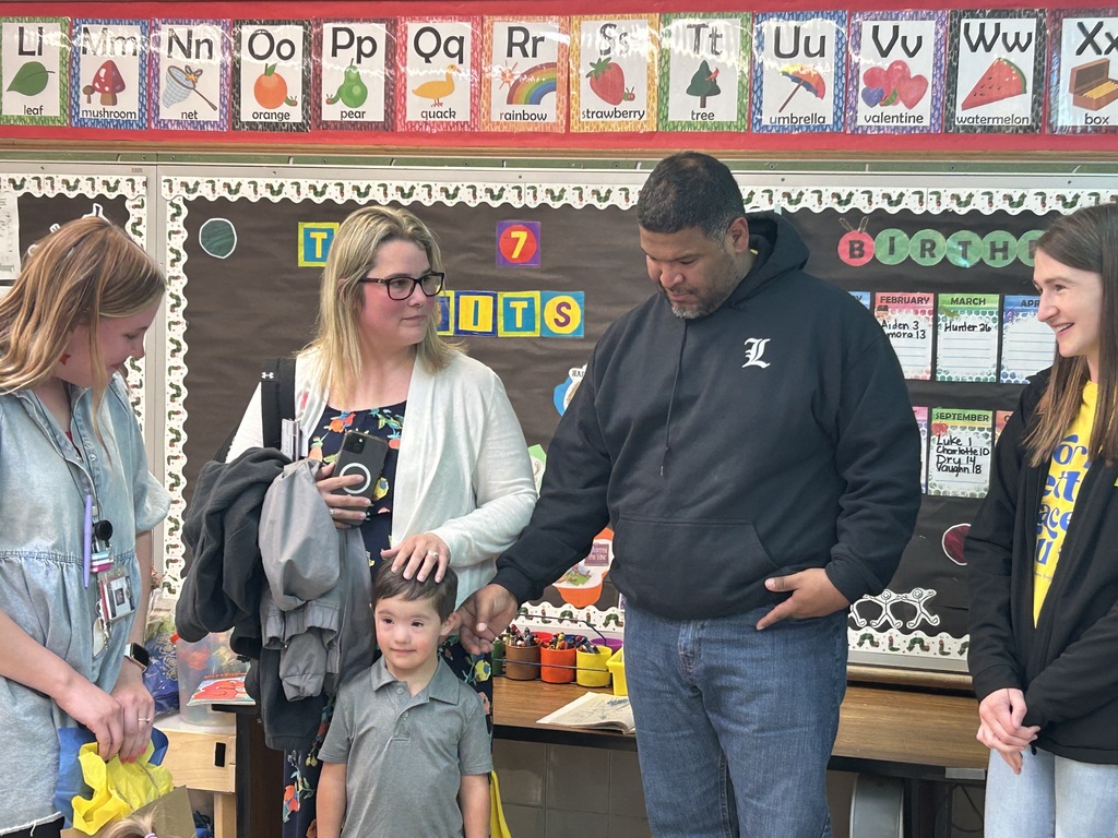 Teacher with parents and a kid 