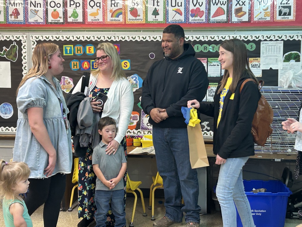 Teacher with parents and a kid 