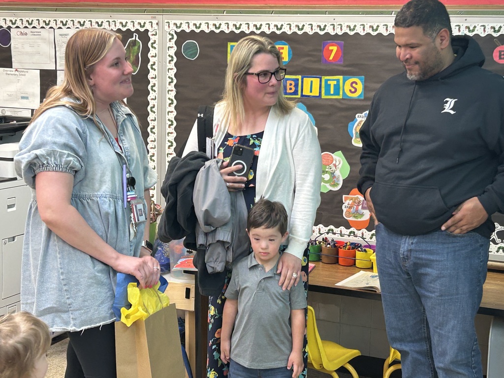 Teacher with parents and a kid 