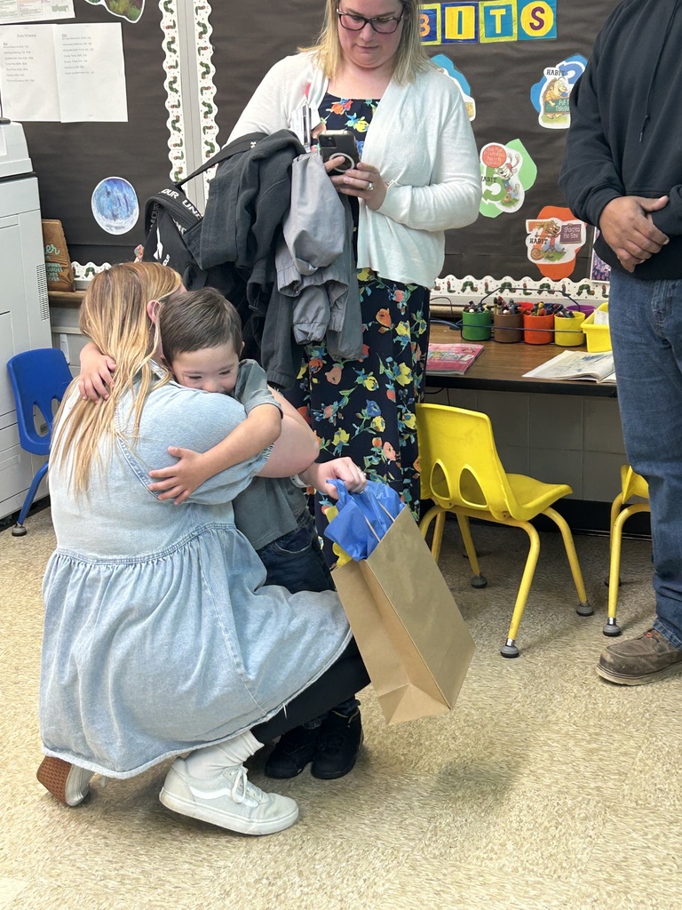 Teacher with parents and a kid 