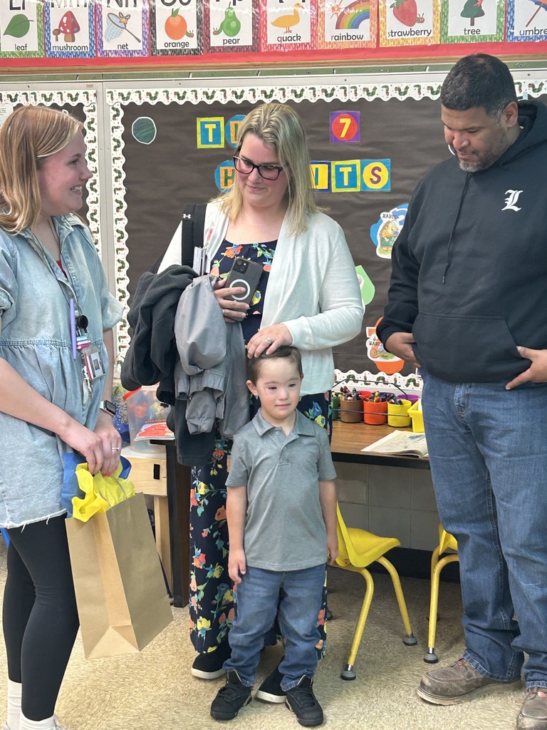 Teacher with parents and a kid 