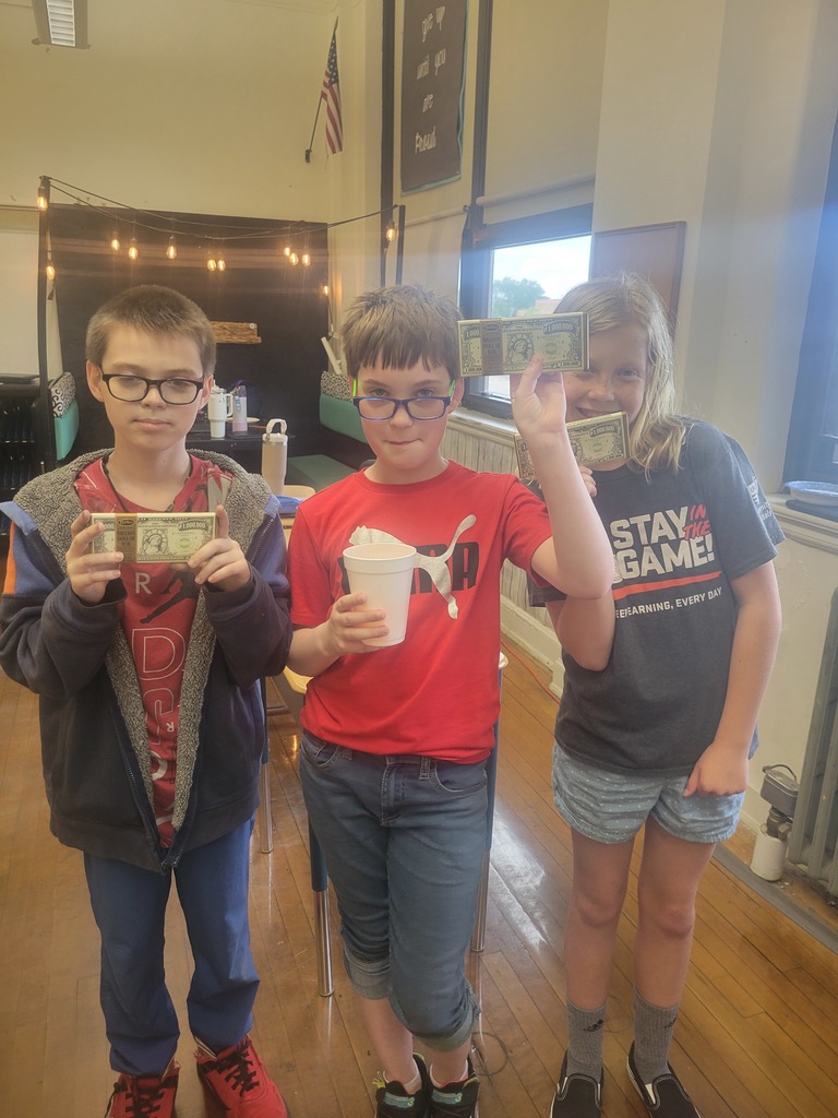 3 kids with fake money and ice cream 