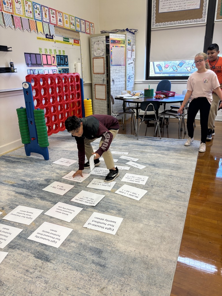 Mrs. Baker’s class had relay races to practice standard form, expanded form, and word form.