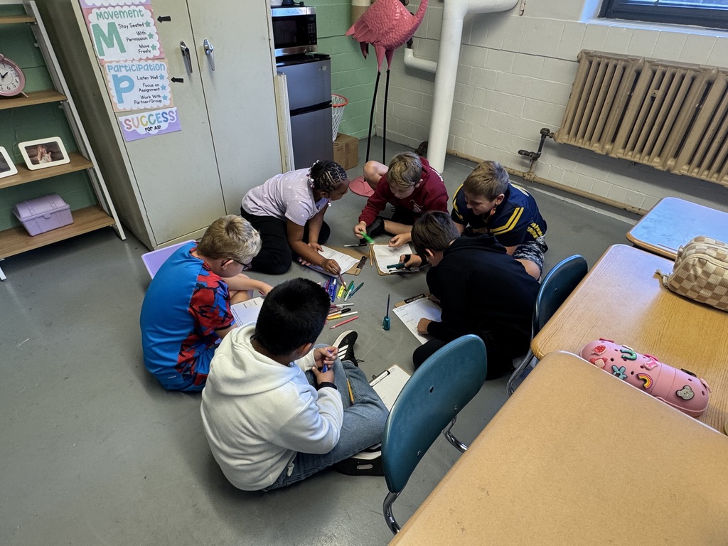 “Students in Mrs. Valentine’s science classes practiced using inquiry skills during a hands-on group activity. The skills they practiced were: observing, communicating, classifying, ordering, and comparing. They worked together to become super scientists!”