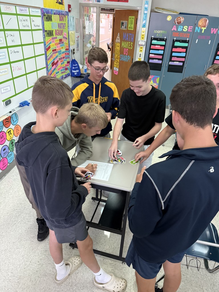 Today in Mrs. Kaple's Honors Geometry the students played UNO to get ready for Geometric Proofs. UNO is used to introduce proofs because it leverages a familiar game to teach abstract concepts by modeling them as a step-by-step puzzle with clear rules. Students can connect to the concept of a proof through the act of playing UNO cards to get from a "given" card to a "prove" card. The rules of UNO serve as the "postulates" or "reasons" for each step (card) in the sequence, helping students understand deductive reasoning and the logical justification required for a formal proof in a hands-on, engaging way.